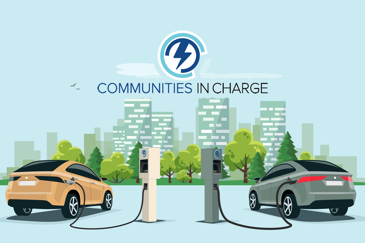 Illustration of two electric cars charging at stations in a park with trees and city buildings in the background. Text above reads “Communities in Charge” with a stylized lightning bolt logo, highlighting California’s $56.5M incentive for apartment and condo EV charging. Illustration of two electric cars charging at stations in a park with trees and city buildings in the background. Text above reads “Communities in Charge” with a stylized lightning bolt logo, highlighting California's $56.5M incentive for apartment and condo EV charging.